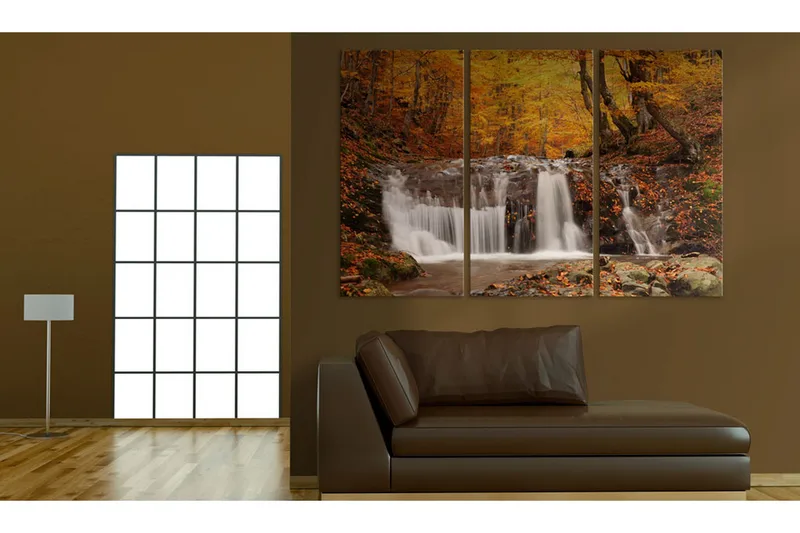 Bilde A waterfall in the middle of fall trees 90x60, Artgeist sp. z o. o.