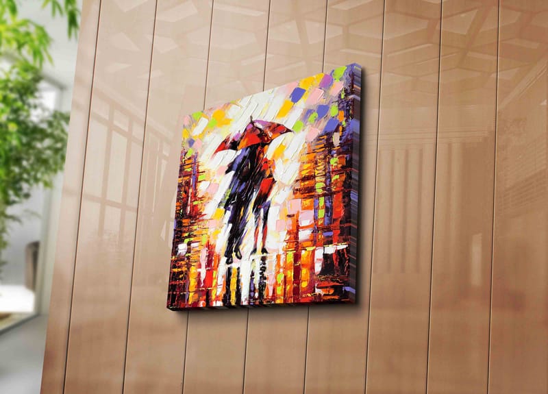 Lerretsbilde 45x45 cm - Silhuett av en person med paraply i et fargerikt bymiljø - Rød / Oransje / Svart - Innredning - Bilder & kunst - Lerretsbilder