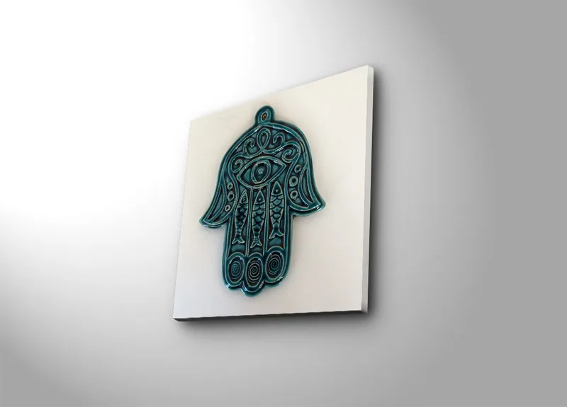 Lerretsbilde 45x45 cm - Symbolsk hånd med øye og intrikate mønstre, Turkis / Hvit