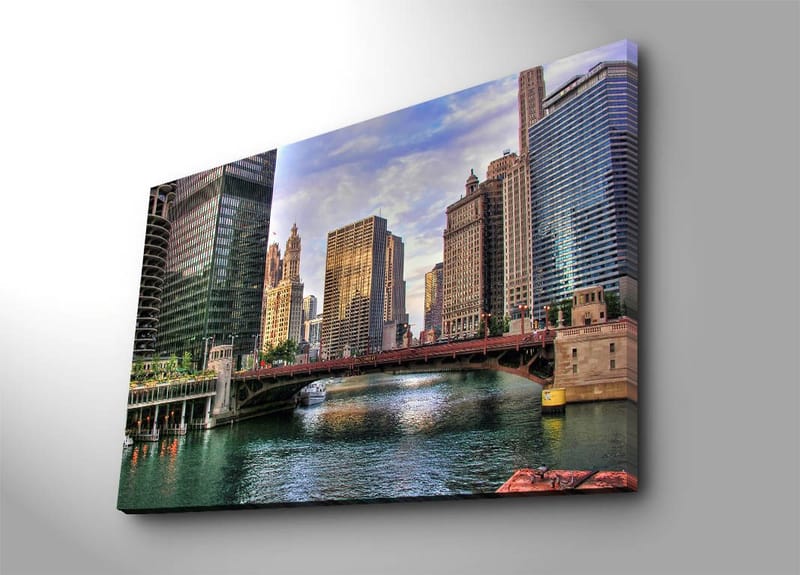 Lerretsbilde 70x100 cm - Bysilhuett med moderne skyskrapere og en bro over en vannvei, Blå / Grønn / Beige
