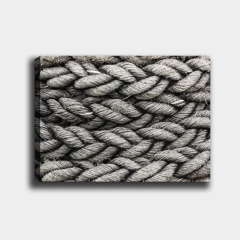 Lerretsbilde 70x100 cm - Detaljert nærbilde av flettet tau med en tekstur som fremhever strukturen og materialiteten, Grå / Svart