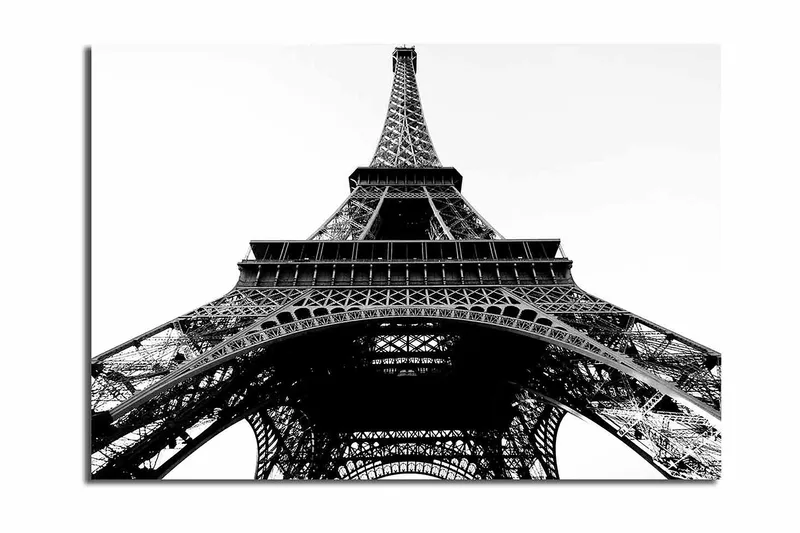 Lerretsbilde 70x100 cm - Dramatisk utsikt over Eiffeltårnet sett fra bunnen av, Svart / Hvit