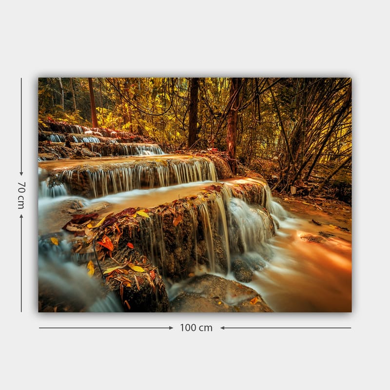 Lerretsbilde 70x100 cm - En vakker foss som renner ned flere nivåer i en høstfarget skog - Gull / Brun / Oransje - Innredning - Bilder & kunst - Lerretsbilder