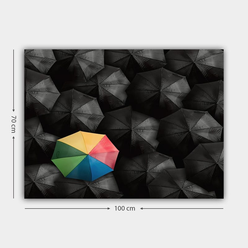 Lerretsbilde 70x100 cm - Ensom fargerik paraply blant en mengde svarte paraplyer - Svart / Gul / Rød - Innredning - Bilder & kunst - Lerretsbilder