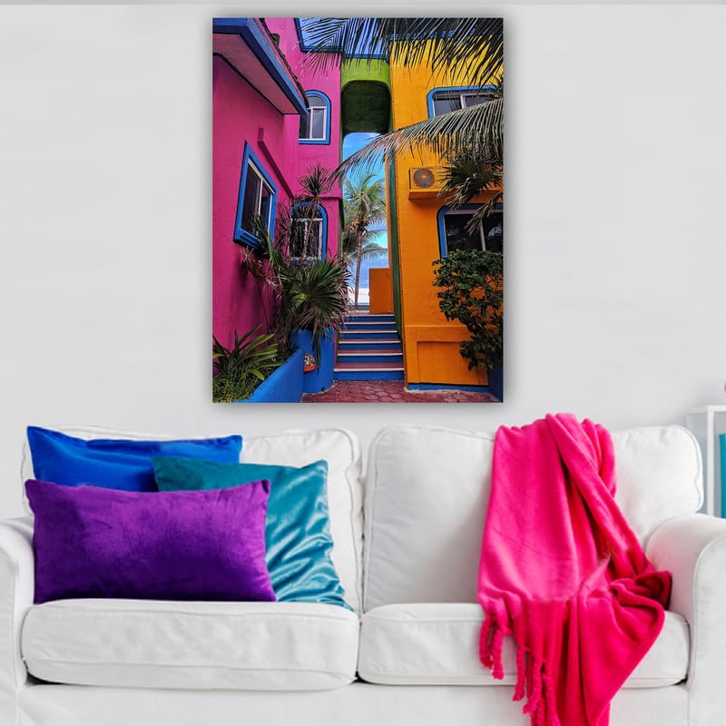 Lerretsbilde 70x100 cm - Fargerik arkitektur med en trapp som fører gjennom en livlig smug - Rosa / Gul / Blå - Innredning - Bilder & kunst - Lerretsbilder