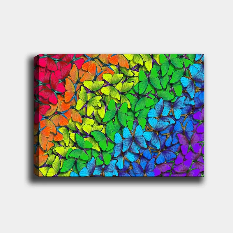 Lerretsbilde 70x100 cm - Fargerik samling av sommerfugler i forskjellige nyanser som skaper en levende og harmonisk komposisjon, Grønn / Blå / Oransje