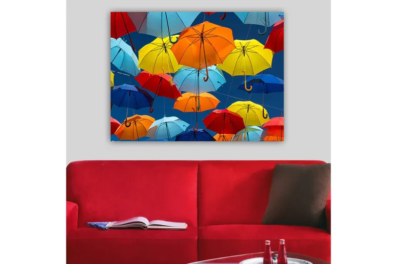 Lerretsbilde 70x100 cm - Fargerike paraplyer som svever i luften, Rød / Blå / Gul