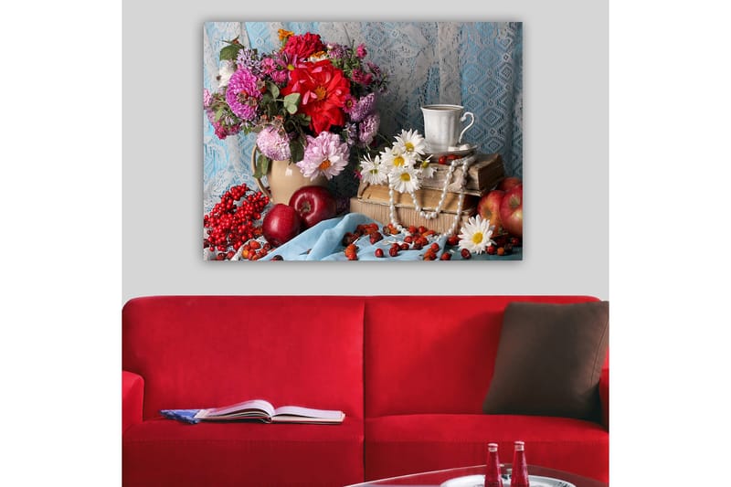 Lerretsbilde 70x100 cm - Fargerikt stilleben med blomster, frukt og en kopp på en stabel med bøker, Rød / Grønn / Lilla