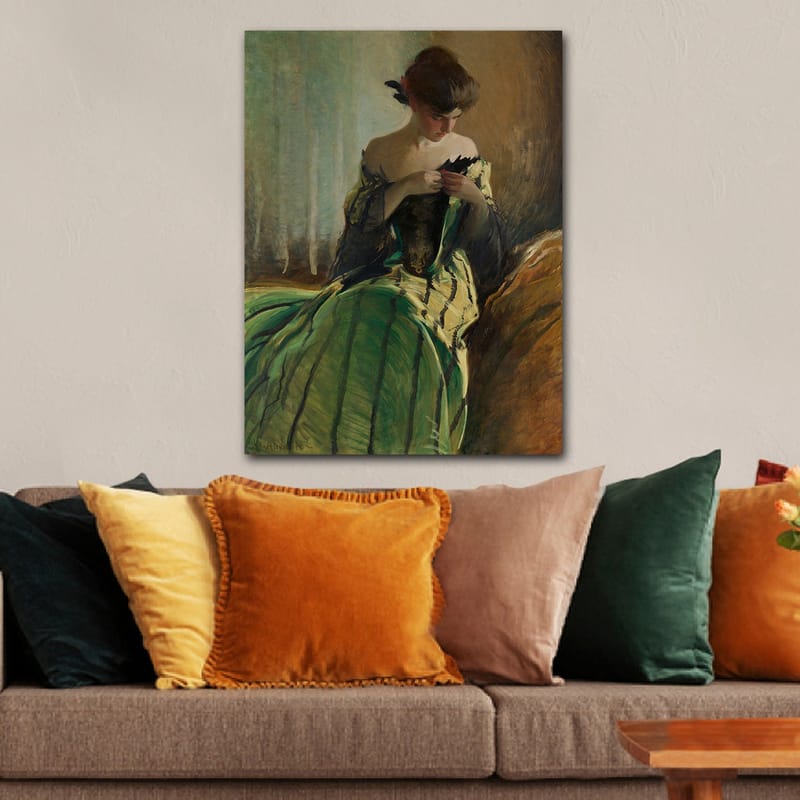 Lerretsbilde 70x100 cm - Kvinne i grønn kjole sitter og arbeider med noe i hendene, dypt fordypet i tanker - Grønn / Svart / Beige - Innredning - Bilder & kunst - Lerretsbilder