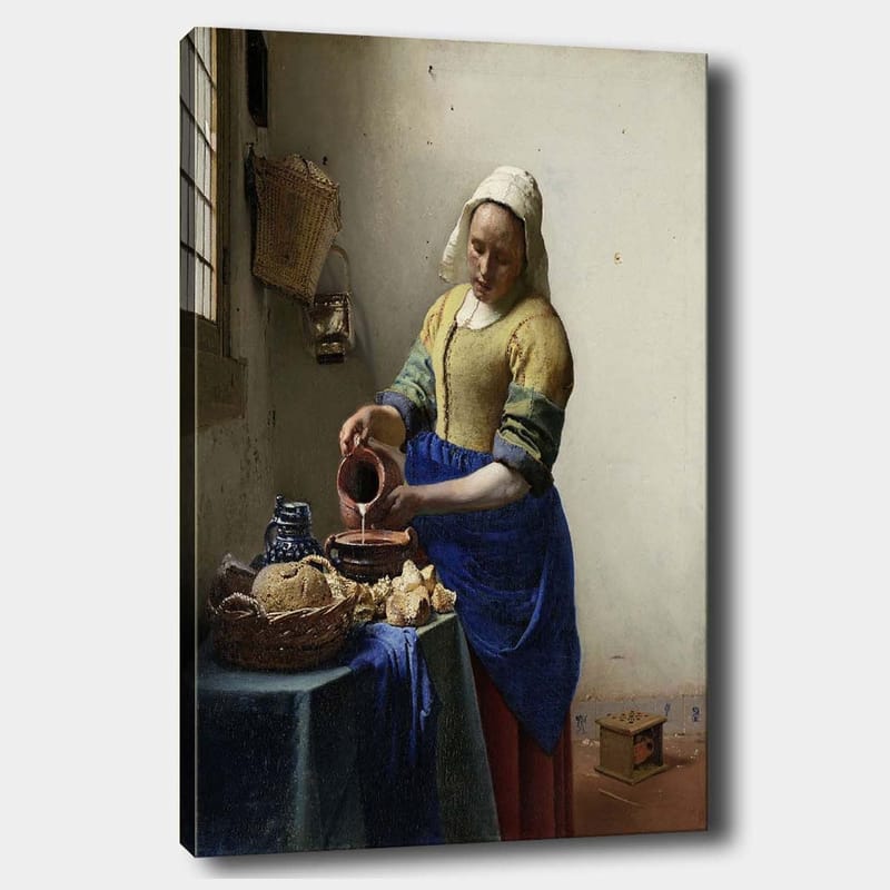 Lerretsbilde 70x100 cm - Kvinne som heller melk i en bolle på et lyst kjøkken, Blå / Gul / Brun