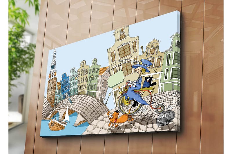 Lerretsbilde 70x100 cm - Kvinne på sykkel med hund og katt, omgitt av fargerike hus og en bro - Blå / Grønn / Oransje - Innredning - Bilder & kunst - Lerretsbilder