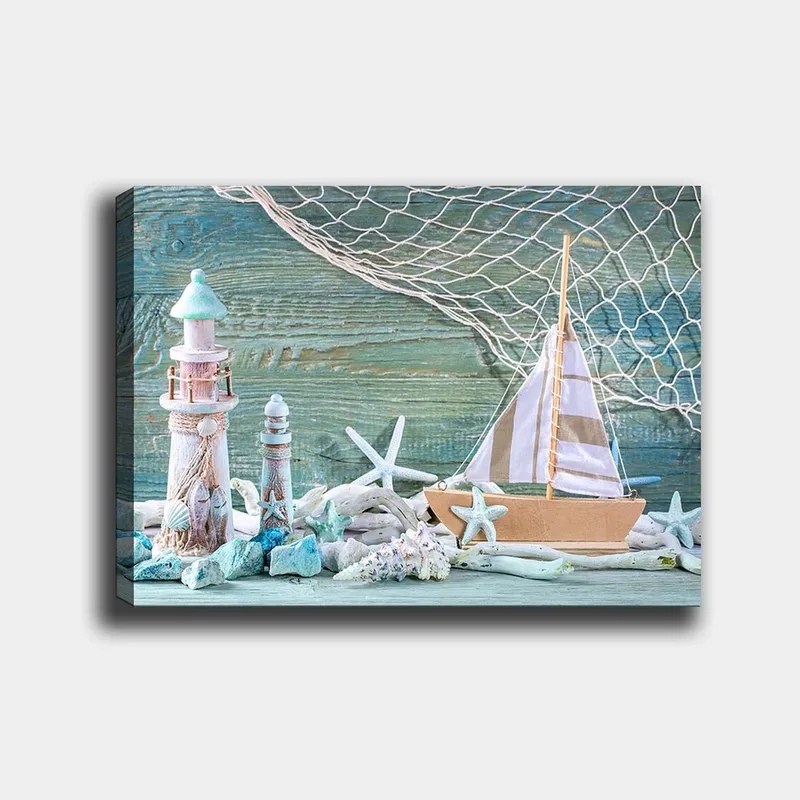 Lerretsbilde 70x100 cm - Maritim scene med seilbåt, fyr og sjøstjerne i strandomgivelser - Blå / Hvit / Beige - Innredning - Bilder & kunst - Lerretsbilder