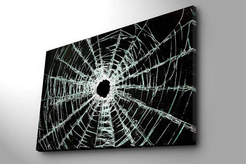 Lerretsbilde 70x100 cm - Nærbilde av en sprukket glassrute med et hull i midten og sprekker som strekker seg utover - Svart / Gjennomsiktig - Innredning - Bilder & kunst - Lerretsbilder