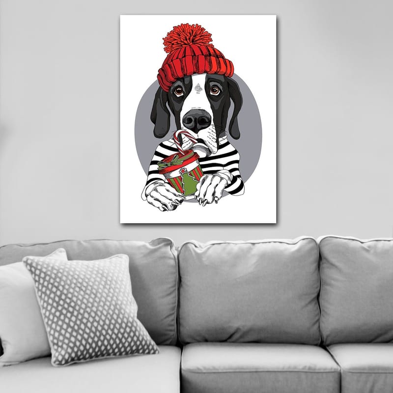 Lerretsbilde 70x100 cm - Søt hund i rød hatt som holder en julegave med en sjokoladebar - Rød / Svart / Grønn - Innredning - Bilder & kunst - Lerretsbilder