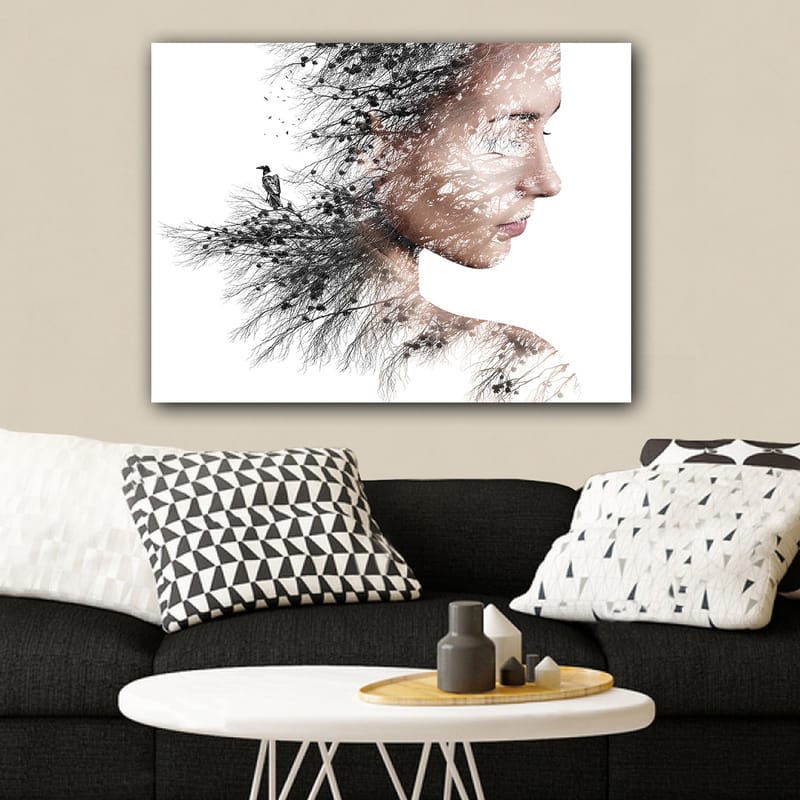 Lerretsbilde 70x100 cm - Stilisert portrett av en kvinne med trær og fugler som en del av silhuetten hennes - Svart / Grå / Brun - Innredning - Bilder & kunst - Lerretsbilder