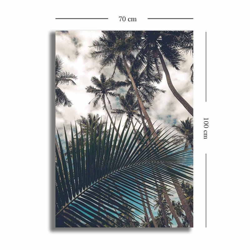 Lerretsbilde 70x100 cm - Tropisk palmelund med et stort palmeblad i forgrunnen - Mørkegrønn / Lysegrønn / Blå - Innredning - Bilder & kunst - Lerretsbilder