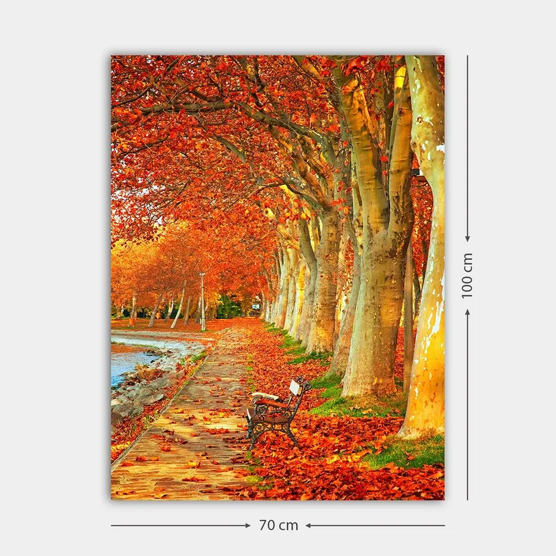 Lerretsbilde 70x100 cm - Vakker høstscene med en benk langs en allé med trær med glitrende røde og oransje blader - Rød / Oransje / Gul - Innredning - Bilder & kunst - Lerretsbilder