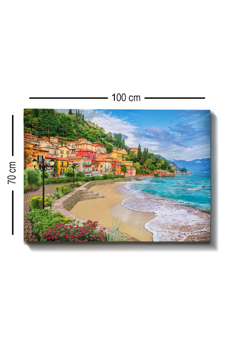 Lerretsbilde 70x100 cm - Vakker kystlinje med fargerike hus som klatrer opp en frodig ås ved en strand - Blå / Grønn / Gul - Innredning - Bilder & kunst - Lerretsbilder