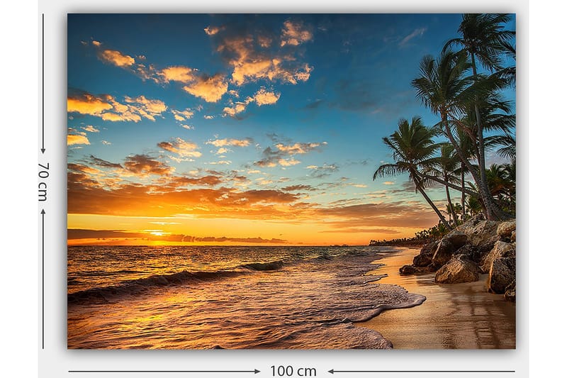 Lerretsbilde 70x100 cm - Vakker solnedgang på en strand med palmer og myke bølger som ruller nedover sanden - Oransje / Blå / Beige - Innredning - Bilder & kunst - Lerretsbilder