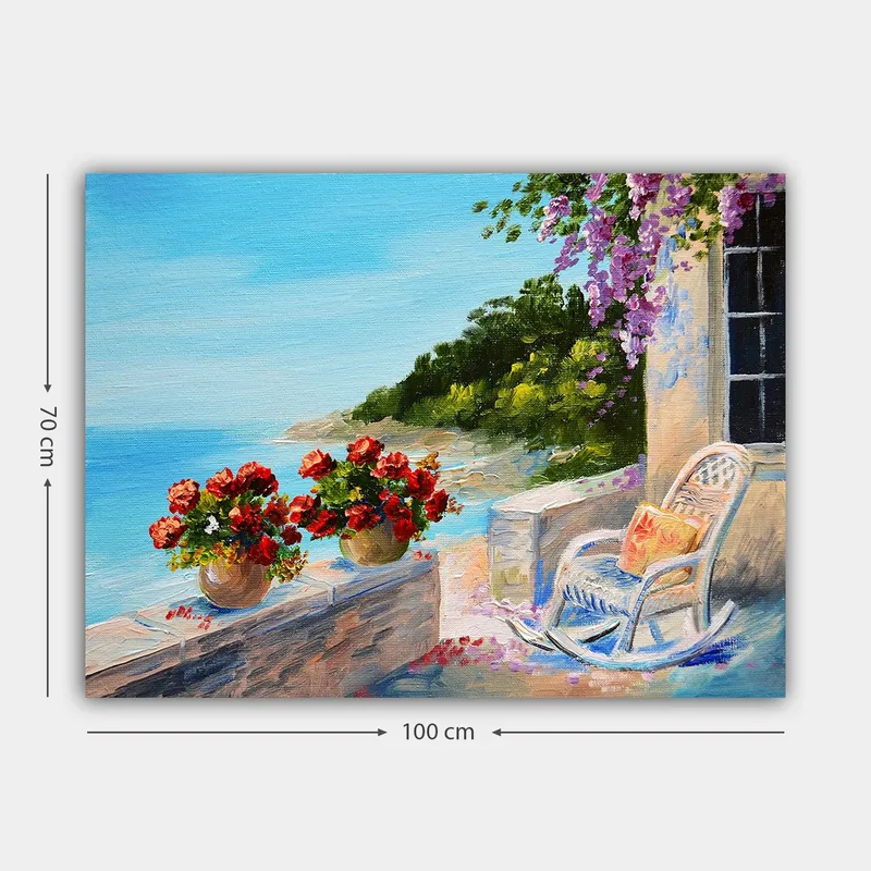 Lerretsbilde 70x100 cm - Vakker utsikt over havet med blomster i potter og en stol på en terrasse - Blå / Grønn / Rød - Innredning - Bilder & kunst - Lerretsbilder