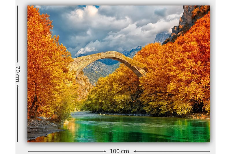 Lerretsbilde 70x100 cm - Vakkert høstlandskap med en gammel steinbro som strekker seg over en glitrende elv omgitt av fargerike trær - Oransje / Grønn / Blå - Innredning - Bilder & kunst - Lerretsbilder