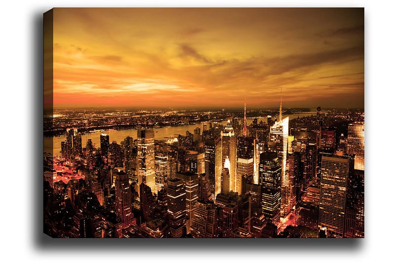 Lerretsbilde 70x100 cm - Panoramautsikt over en by ved solnedgang med høye bygninger og en dramatisk himmel - Oransje / Gull / Svart - Innredning - Bilder & kunst - Lerretsbilder