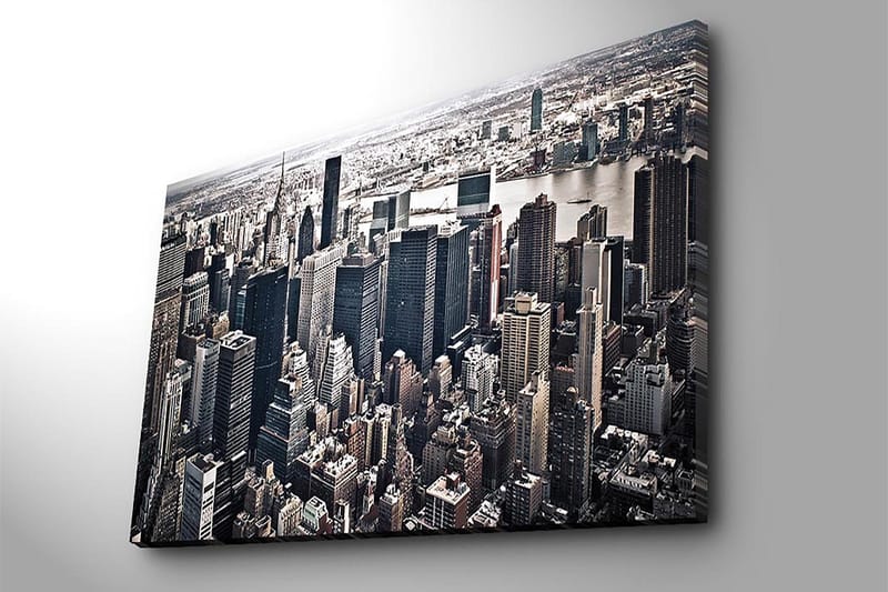 Lerretsbilde 70x100 cm - Panoramautsikt over en by med høye skyskrapere og et livlig bybilde - Svart / Grå / Hvit - Innredning - Bilder & kunst - Lerretsbilder