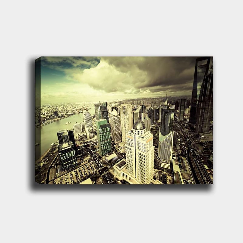 Lerretsbilde 70x100 cm - Panoramautsikt over en moderne by med høye skyskrapere og en elv som renner gjennom landskapet, Grønn / Grå / Beige