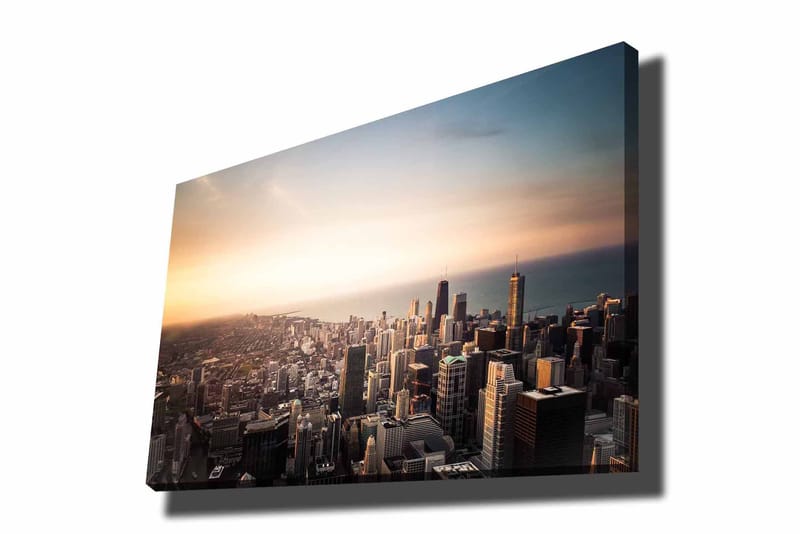 Lerretsbilde 70x100 cm - Panoramautsikt over en by med høye skyskrapere og en solnedgang som skaper en dramatisk atmosfære - Blå / Oransje / Grå - Innredning - Bilder & kunst - Lerretsbilder