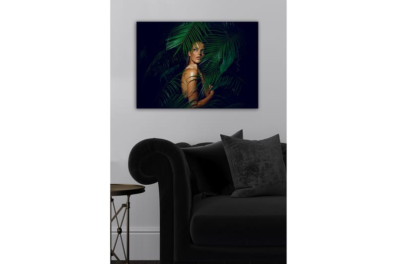 Lerretsbilde - Kvinne delvis skjult bak grønne palmeblader - Mørkegrønn / Hudtone / Svart - Innredning - Bilder & kunst - Lerretsbilder