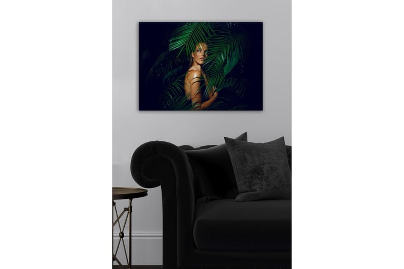 Lerretsbilde - Kvinne delvis skjult bak grønne palmeblader - Mørkegrønn / Hudtone / Svart - Innredning - Bilder & kunst - Lerretsbilder
