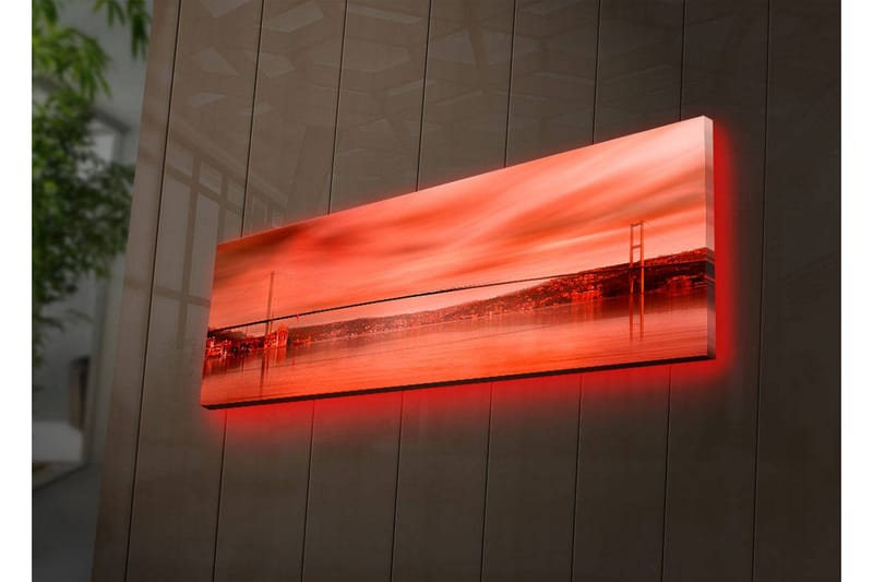 Lerretsbilde med LED-belysning 30x90 cm - Storslått utsikt over en bro over en speilblank vannflate i solnedgangens farger - Rød / Oransje / Svart - Innredning - Bilder & kunst - Lerretsbilder