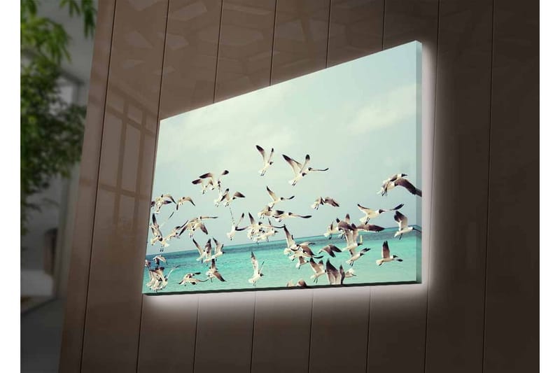 Lerretsbilde med LED-belysning - Flok med fugler som flyr over en blå havoverflate - Lyseblå / Hvit / Svart - Innredning - Bilder & kunst - Lerretsbilder