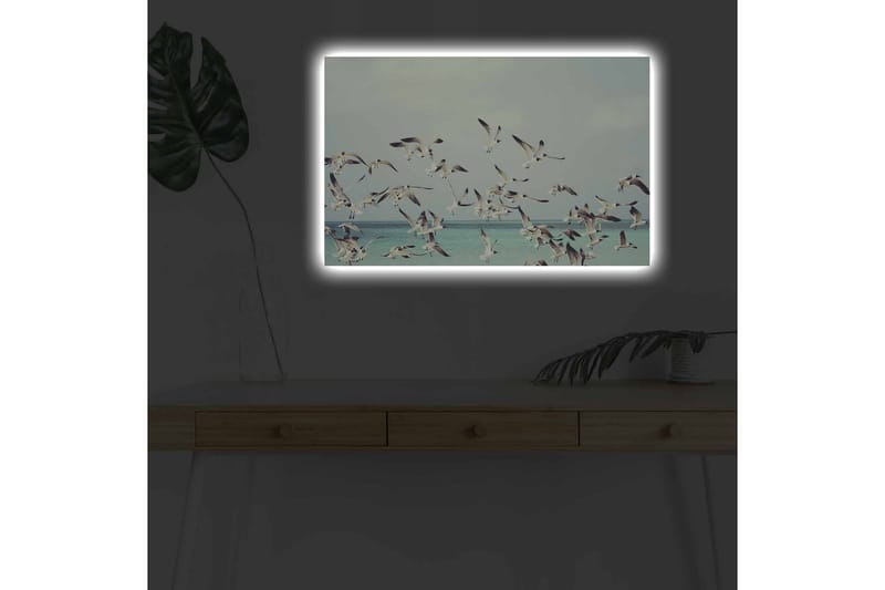 Lerretsbilde med LED-belysning - Flok med fugler som flyr over en blå havoverflate - Lyseblå / Hvit / Svart - Innredning - Bilder & kunst - Lerretsbilder