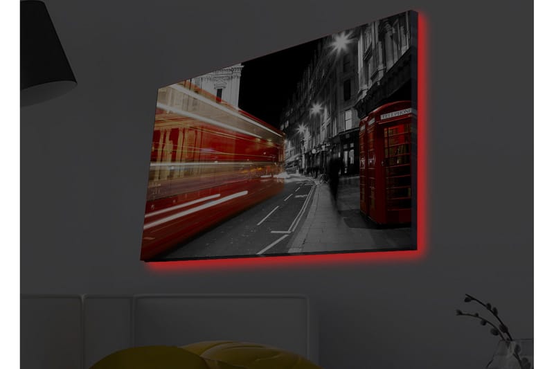 Lerretsbilde med LED-belysning - Rød buss i bevegelse på en svart-hvit bygate - Rød / Svart / Grå - Innredning - Bilder & kunst - Lerretsbilder