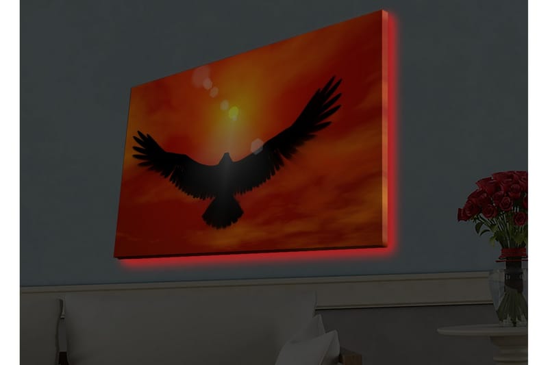 Lerretsbilde med LED-belysning - Silhuett av en ørn som flyr mot en solnedgang i sterke farger - Rød / Svart / Oransje - Innredning - Bilder & kunst - Lerretsbilder