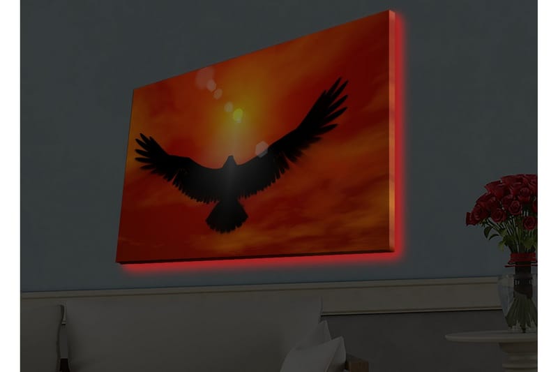 Lerretsbilde med LED-belysning - Silhuett av en ørn som flyr mot en solnedgang i sterke farger - Rød / Svart / Oransje - Innredning - Bilder & kunst - Lerretsbilder