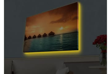Lerretsbilde med LED-belysning - Solnedgang over en tropisk strand med bungalower over vannet - Oransje / Turkis - Innredning - Bilder & kunst - Lerretsbilder