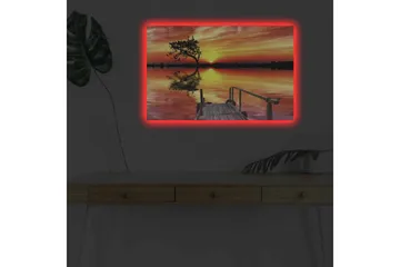 Lerretsbilde med LED-belysning - Vakker solnedgang over en speilblank innsjø med en ensom trebredde - Oransje / Gul / Svart - Innredning - Bilder & kunst - Lerretsbilder