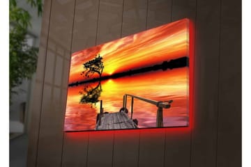 Lerretsbilde med LED-belysning - Vakker solnedgang over en speilblank innsjø med en ensom trebredde - Oransje / Gul / Svart - Innredning - Bilder & kunst - Lerretsbilder