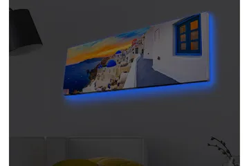 Lerretsbilde med LED-belysning - Vakker utsikt over hvite hus med blå kupler mot havet og en fargerik solnedgang - Blå / Hvit / Oransje - Innredning - Bilder & kunst - Lerretsbilder