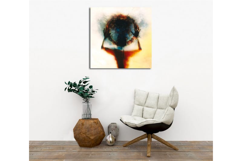 Lerretsbilde - Silhuett av en person som holder en sirkel av farger og lys - Svart / Blå / Rød - Innredning - Bilder & kunst - Lerretsbilder