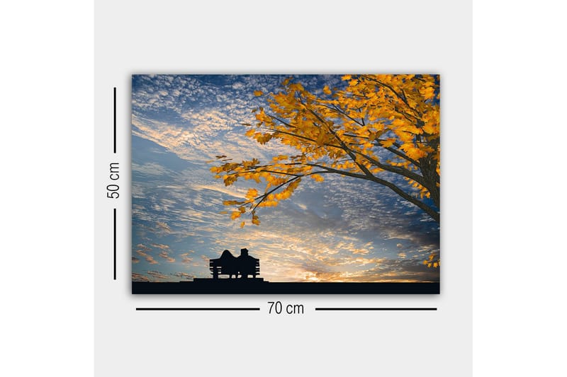 Lerretsbilde - Silhuett av et par som sitter på en benk under et tre med gyldne høstblader - Gull / Blå / Svart - Innredning - Bilder & kunst - Lerretsbilder
