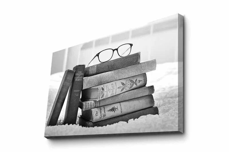 Lerretsbilde - Stabel med bøker med briller på toppen, Svart / Grå / Hvit