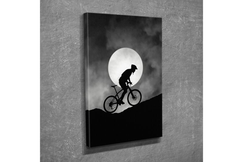 Lerretsbilde - Syklist som klatrer opp en bakke under en stor måne - Svart / Grå - Innredning - Bilder & kunst - Lerretsbilder