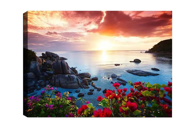 Lerretsbilde - Vakker solnedgang over havet med blomster i forgrunnen - Rosa / Blå / Oransje - Innredning - Bilder & kunst - Lerretsbilder