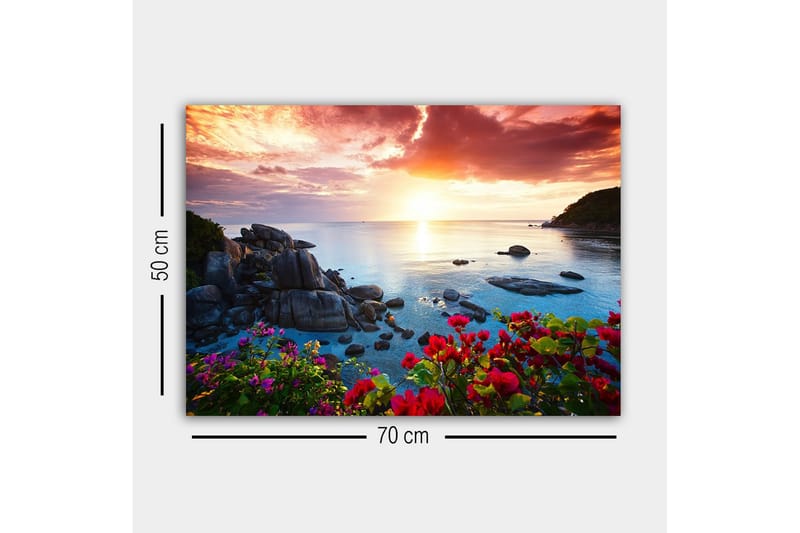 Lerretsbilde - Vakker solnedgang over havet med blomster i forgrunnen - Rosa / Blå / Oransje - Innredning - Bilder & kunst - Lerretsbilder
