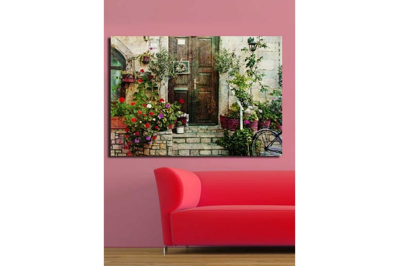 Stort lerretsbilde 100x70 cm - Vakker dør omgitt av fargerike blomster og grøntområder - Rød / Grønn / Lilla - Innredning - Bilder & kunst - Lerretsbilder